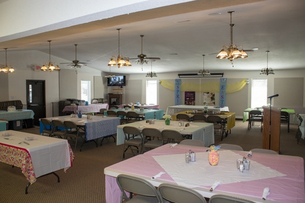 A church fellowship hall with tables set out for a function